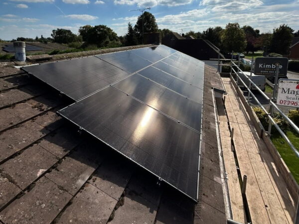 solar installation in Maidenhead, showing angled roof panels with sun reflection